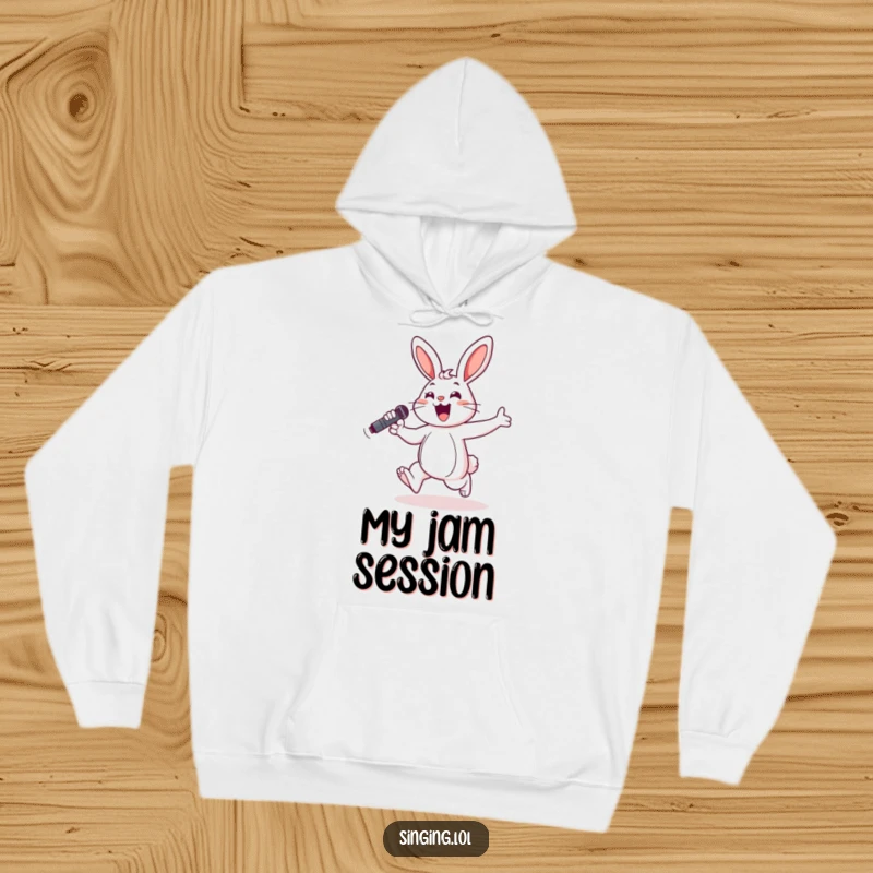 Funny hoodie with a cheerful bunny hopping and singing into a microphone, perfect for cozy music sessions.