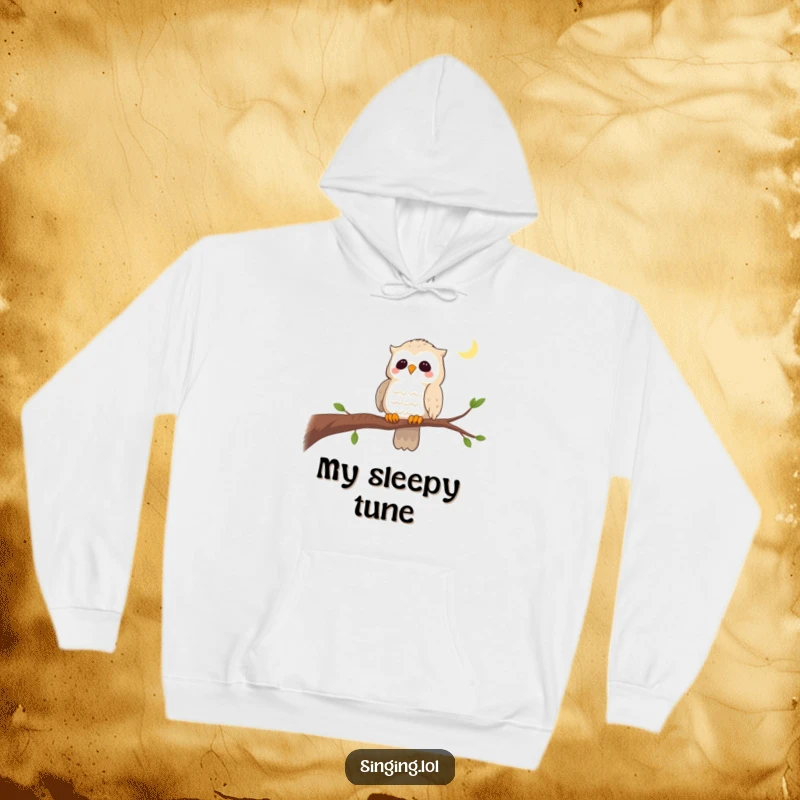 Funny hoodie with a curious owl singing a lullaby on a branch, offering warmth and a touch of serene wisdom.