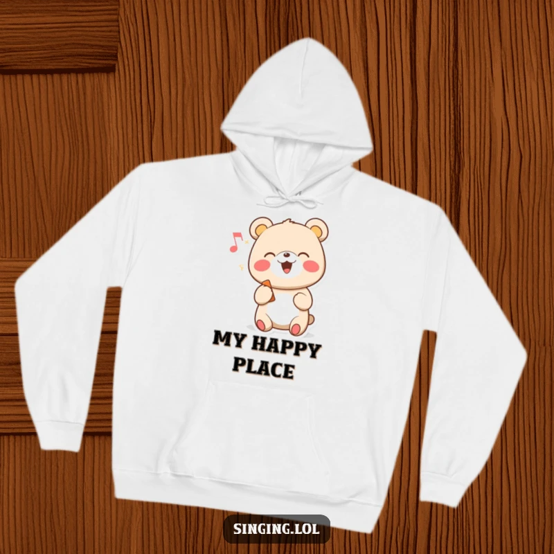 Funny hoodie with a cheerful cartoon bear character singing happily, adorned with a musical note.