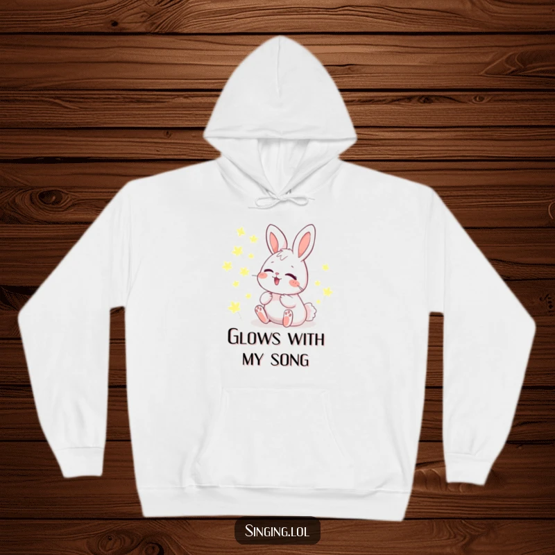 Funny Hoodie depicting a giggling bunny harmonizing with a magical chorus of glowing fireflies, perfect for cozy nights.