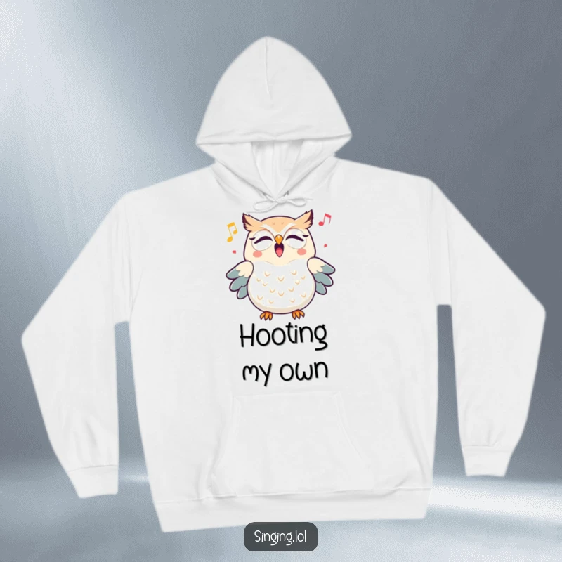 Funny triumphant owl character hooting a cheerful melody, featured on a soft and warm hoodie, perfect for cool evenings.