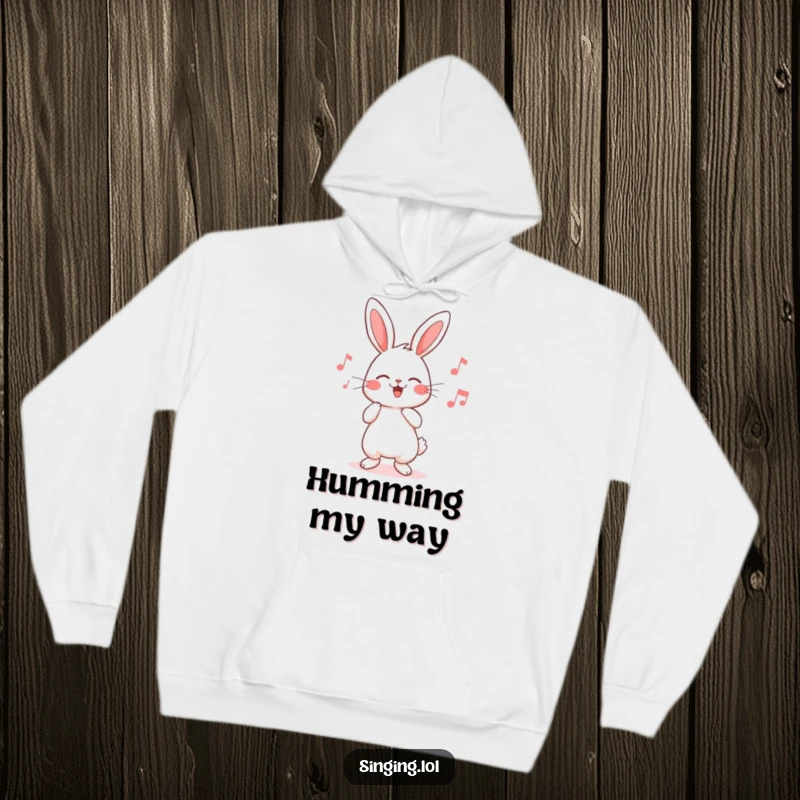 Funny rabbit hoodie featuring an adorable character humming a joyful tune, designed for ultimate comfort and heartwarming smiles.