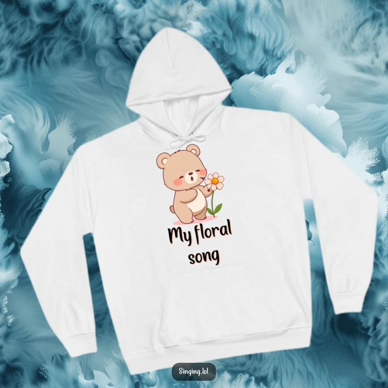 Funny hoodie with a small bear tapping its foot while singing into a flower, offering warmth and a touch of natural melody.