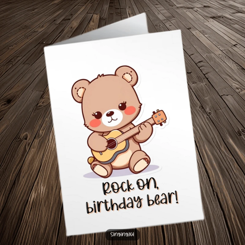 Funny Free Printable Birthday Card: A playful bear cub character enthusiastically strumming a tiny guitar with musical flair.