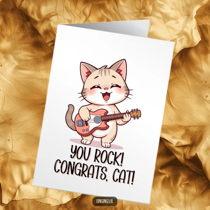 Funny Free Printable Congratulations Card: Smiling cat strums a mini guitar, celebrating your fantastic achievement with musical joy.